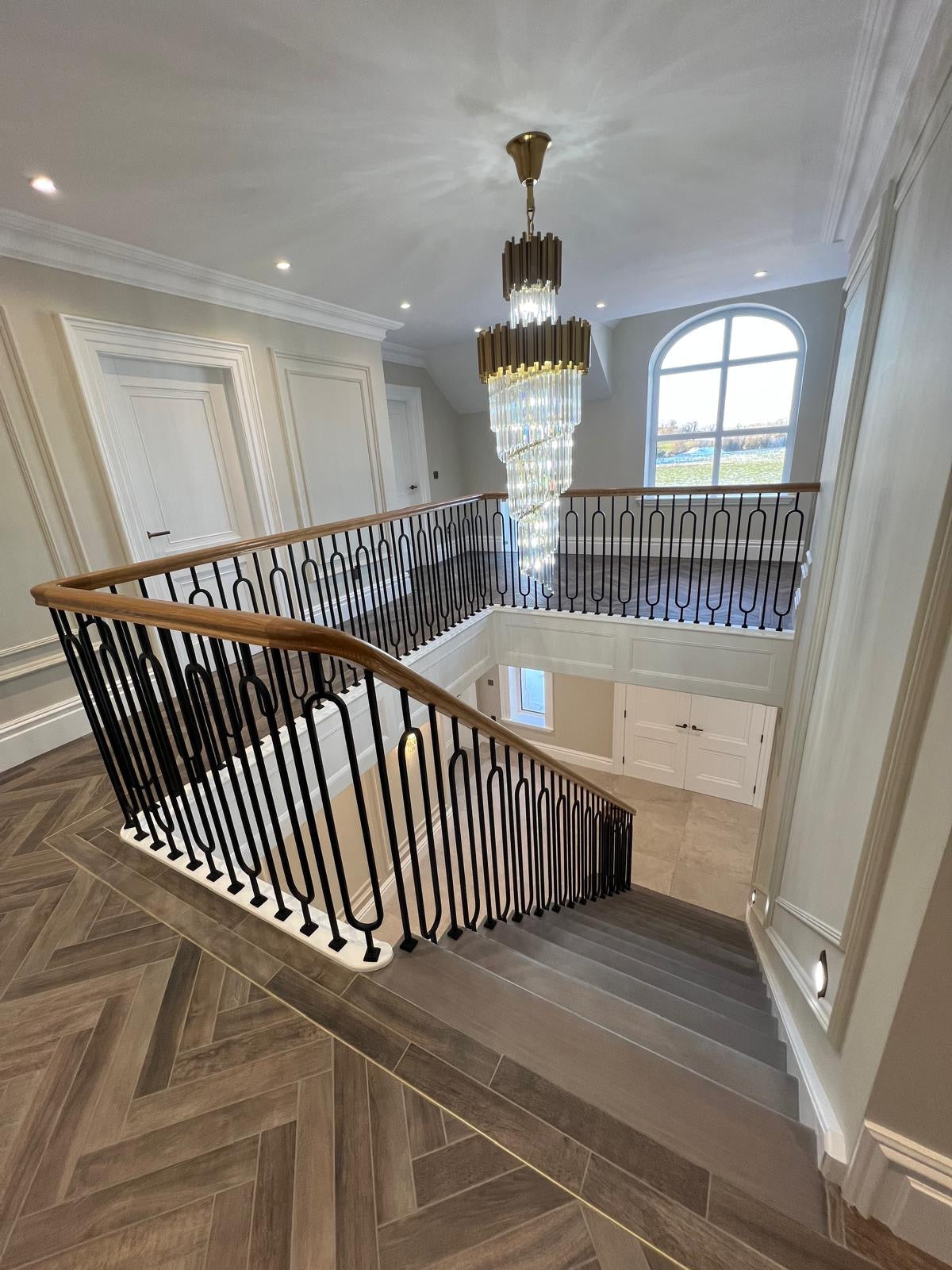 VORELLI luxury staircase chandelier in double height residential interior ready to ship UK