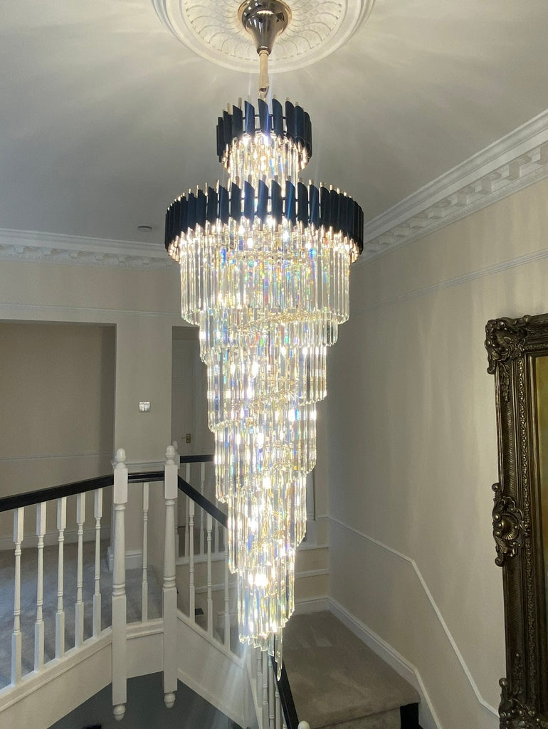 Exquisite crystal chandelier illuminating a beautifully designed interior, showcasing the grandeur of the Milltimber Collection by Vorelli Lighting.