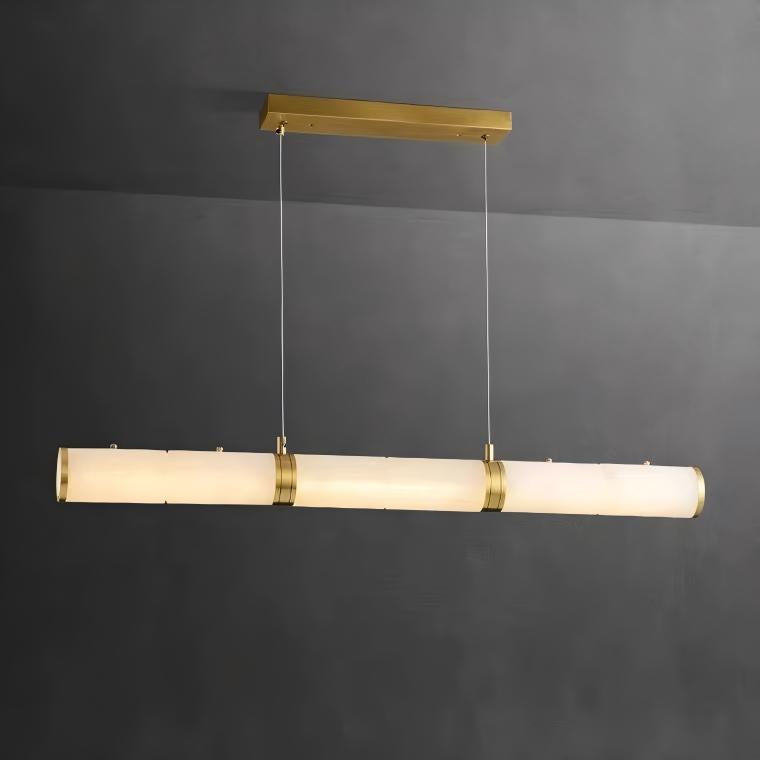 Avora Marble Rectangular Chandelier featuring warm alabaster tones suspended against a charcoal wall.