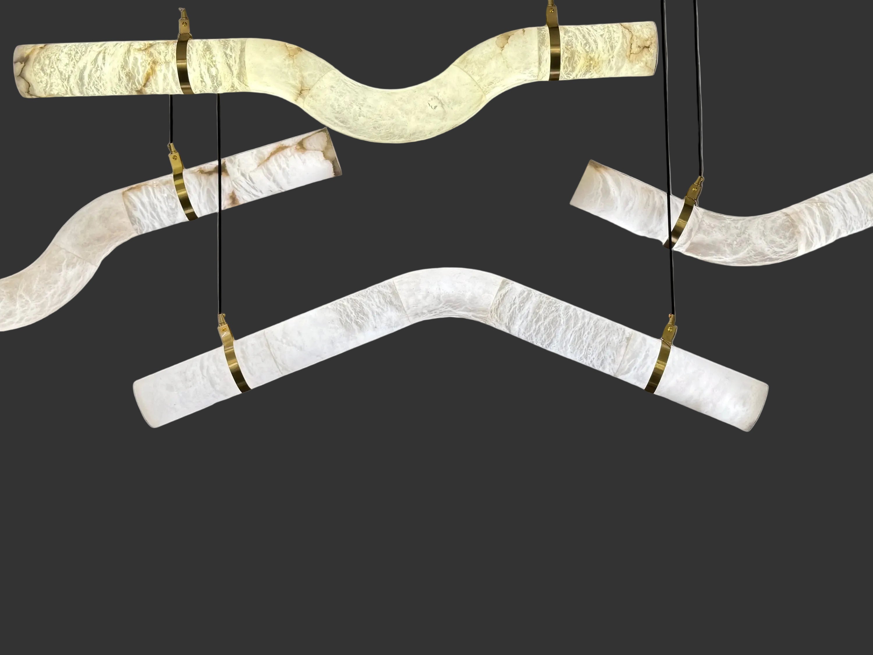 Caesar Marble Rectangular Chandelier featuring sculpted illuminated marble segments with elegant brass suspension detailing.