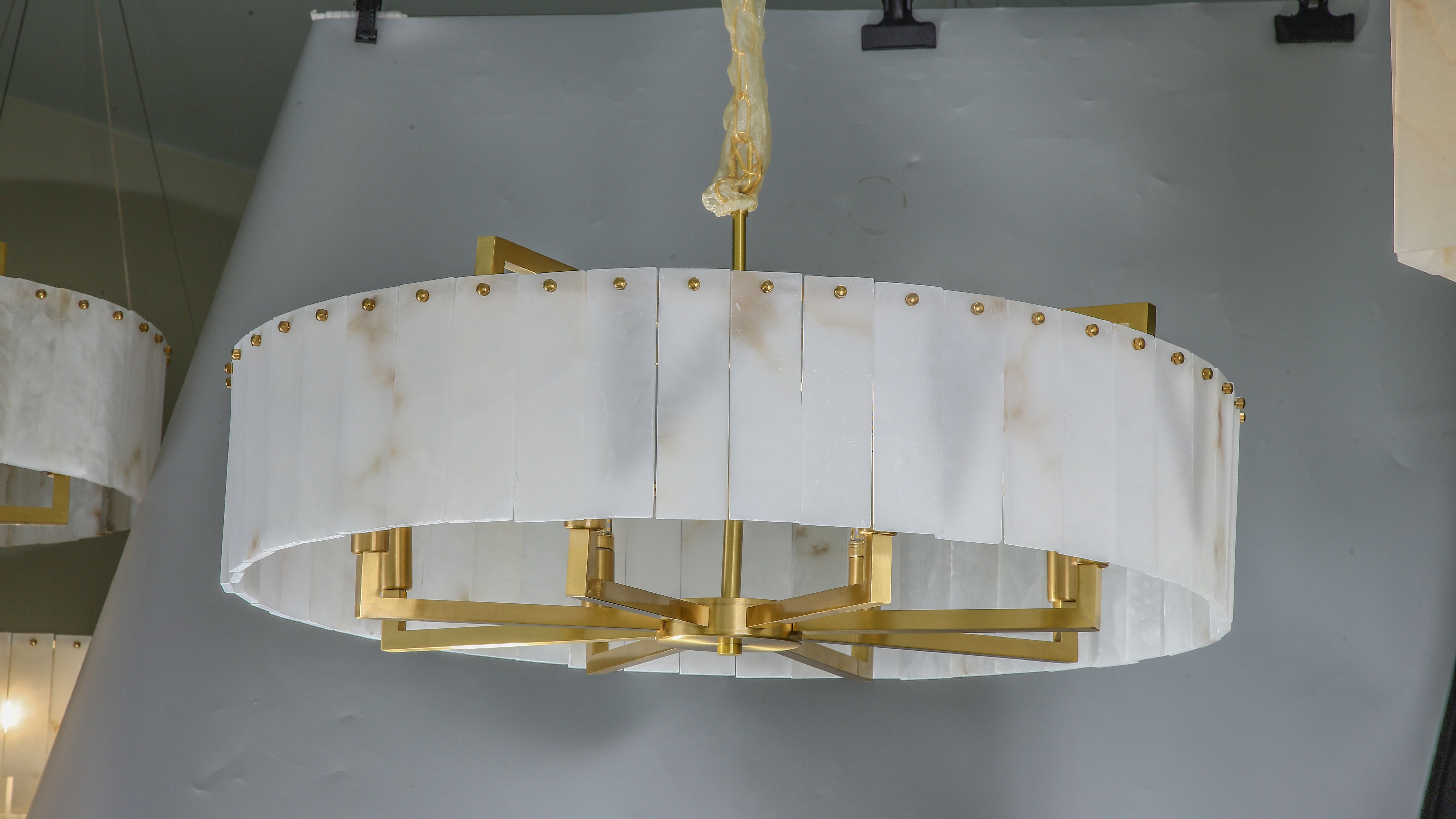classisco chandelier side angle highlighting marble texture and gold accents
