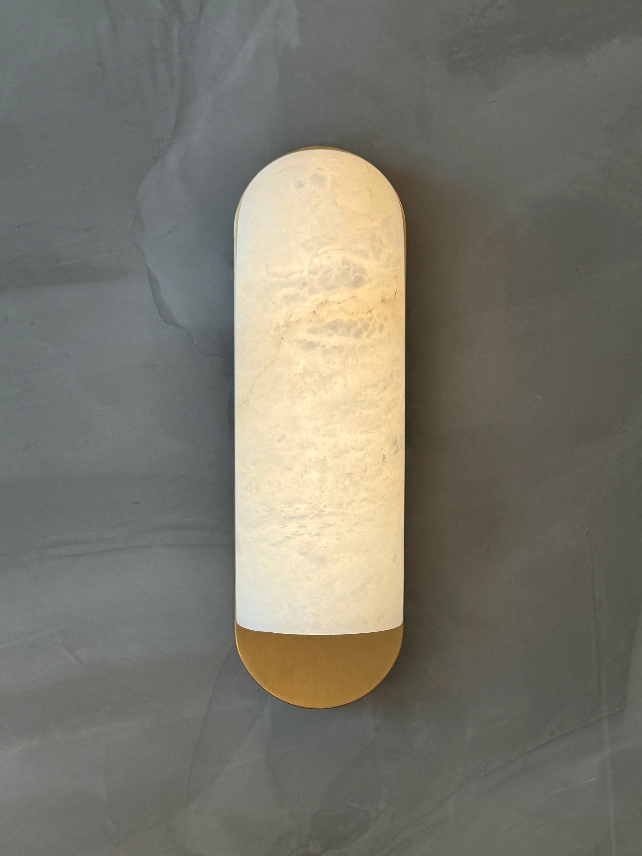 Formello minimalist marble wall light photographed on neutral background