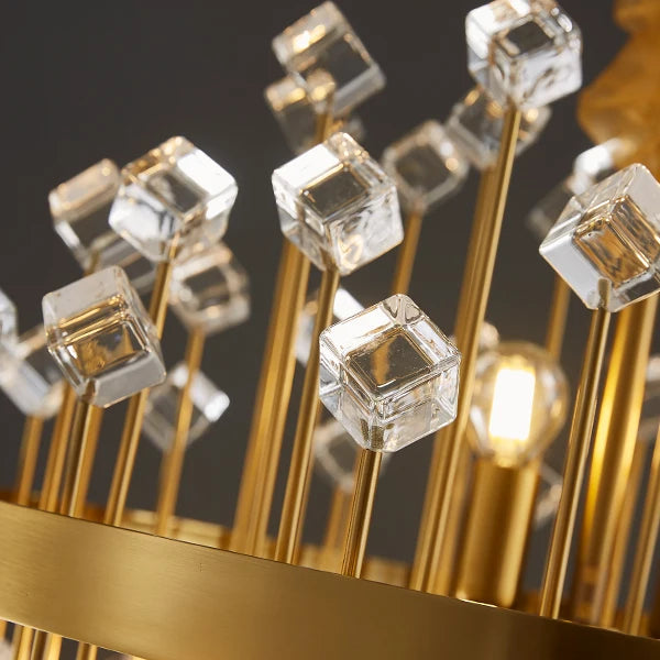 Close-up detail of clear cracked crystals on the Alytus chandelier with refined gold bar accents.