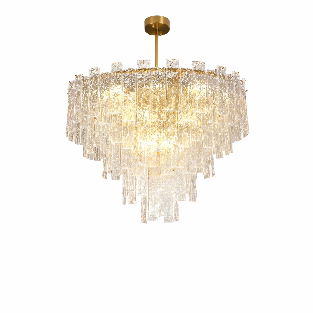 Luxury rectangular crystal chandelier with cascading textured glass prisms, warm integrated illumination, and a polished gold ceiling bar with twin suspension rods, displayed above a modern dining interior with dark panelled wall and floor-to-ceiling window.
