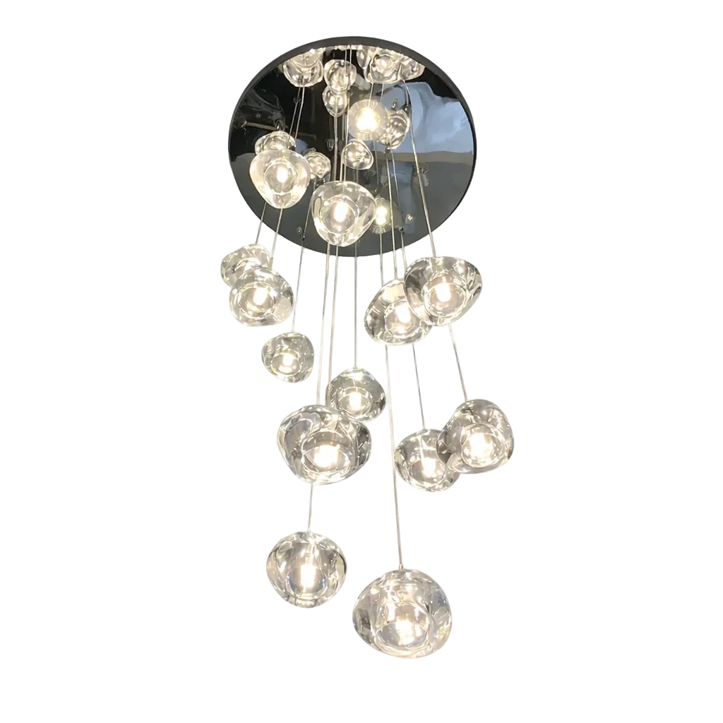 Modern VORELLI® staircase chandelier with multiple clear sculpted glass pendant lights suspended at varying lengths from a circular mirrored ceiling plate, illuminated against a pure white background.