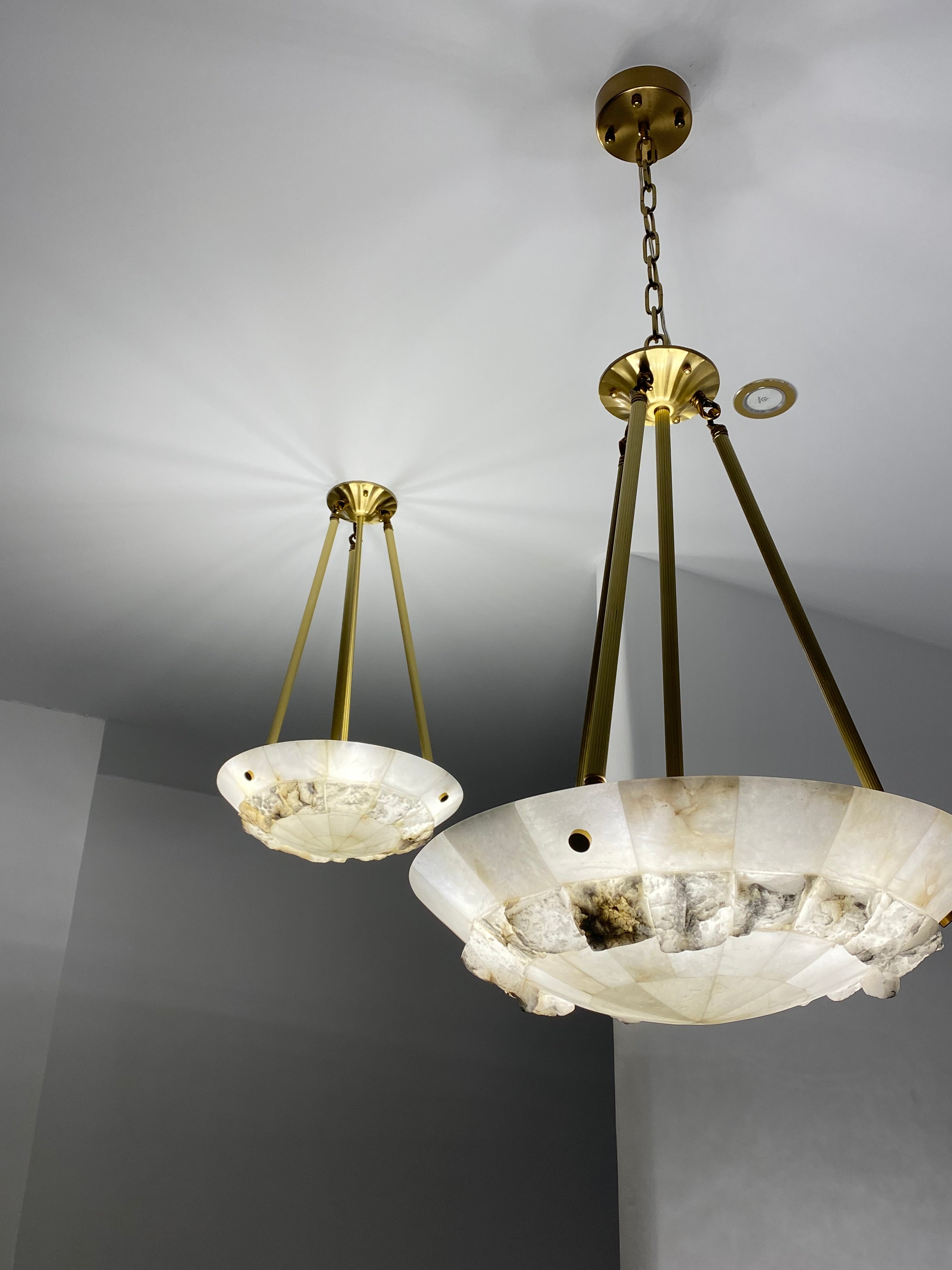 Luxury marble disc chandelier design creating soft ambient lighting for modern interiors