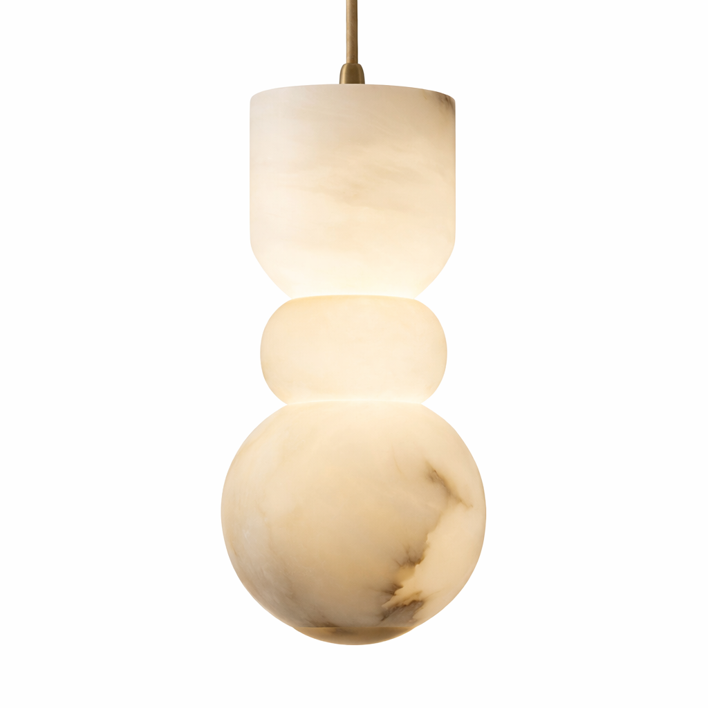 A close-up view highlighting the intricate natural veining of the sculpted marble and the ambient, sophisticated mood created by the Arella Pendant Light's soft illumination.