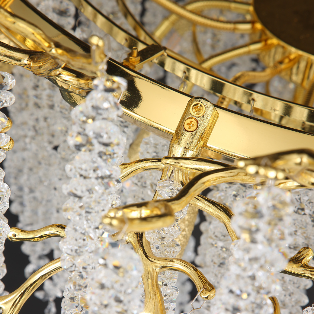 A mood-focused shot of the VORELLI Wisteria Chandelier, showcasing the quiet drama and refined movement of its crystal elements in an architectural setting.