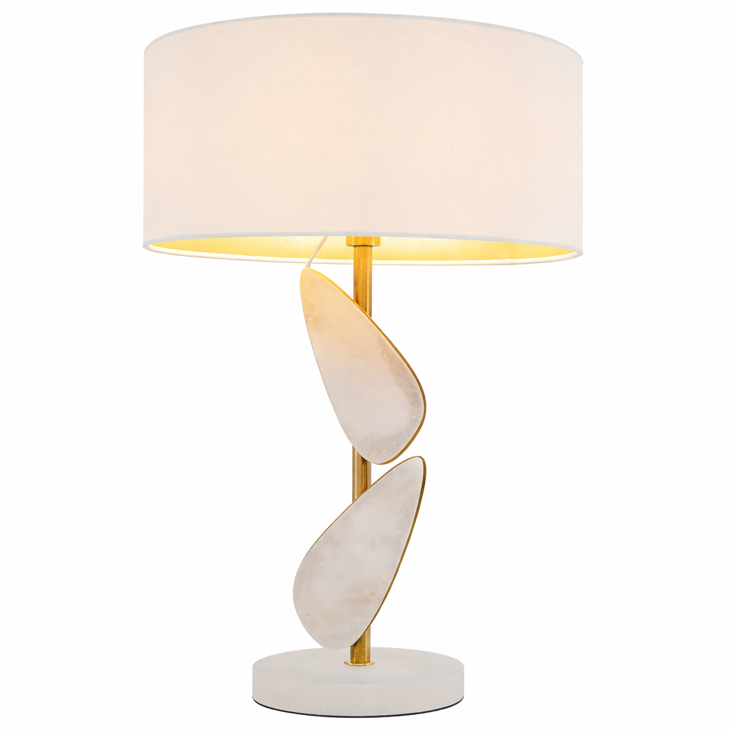 A sophisticated mood featuring the Alenya table lamp casting soft, textured shadows over a luxury interior setting.