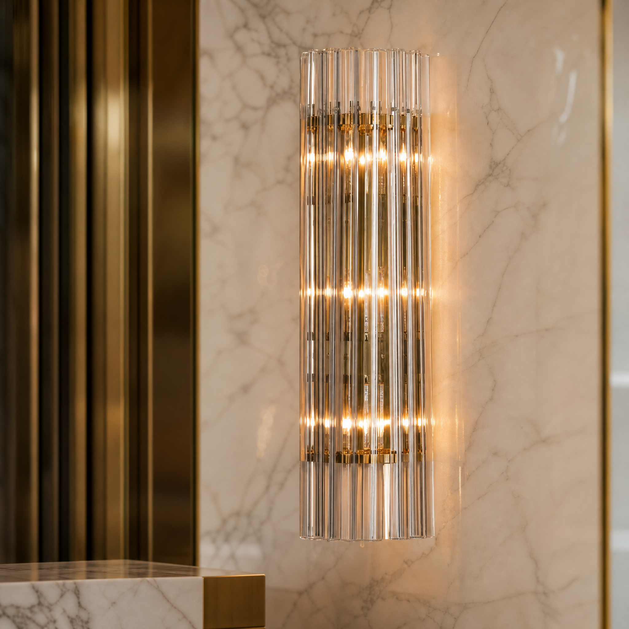 Macro closeup of the VORELLI Amarino wall light highlighting the intricate texture of the individual clear glass pieces and premium metal hardware.