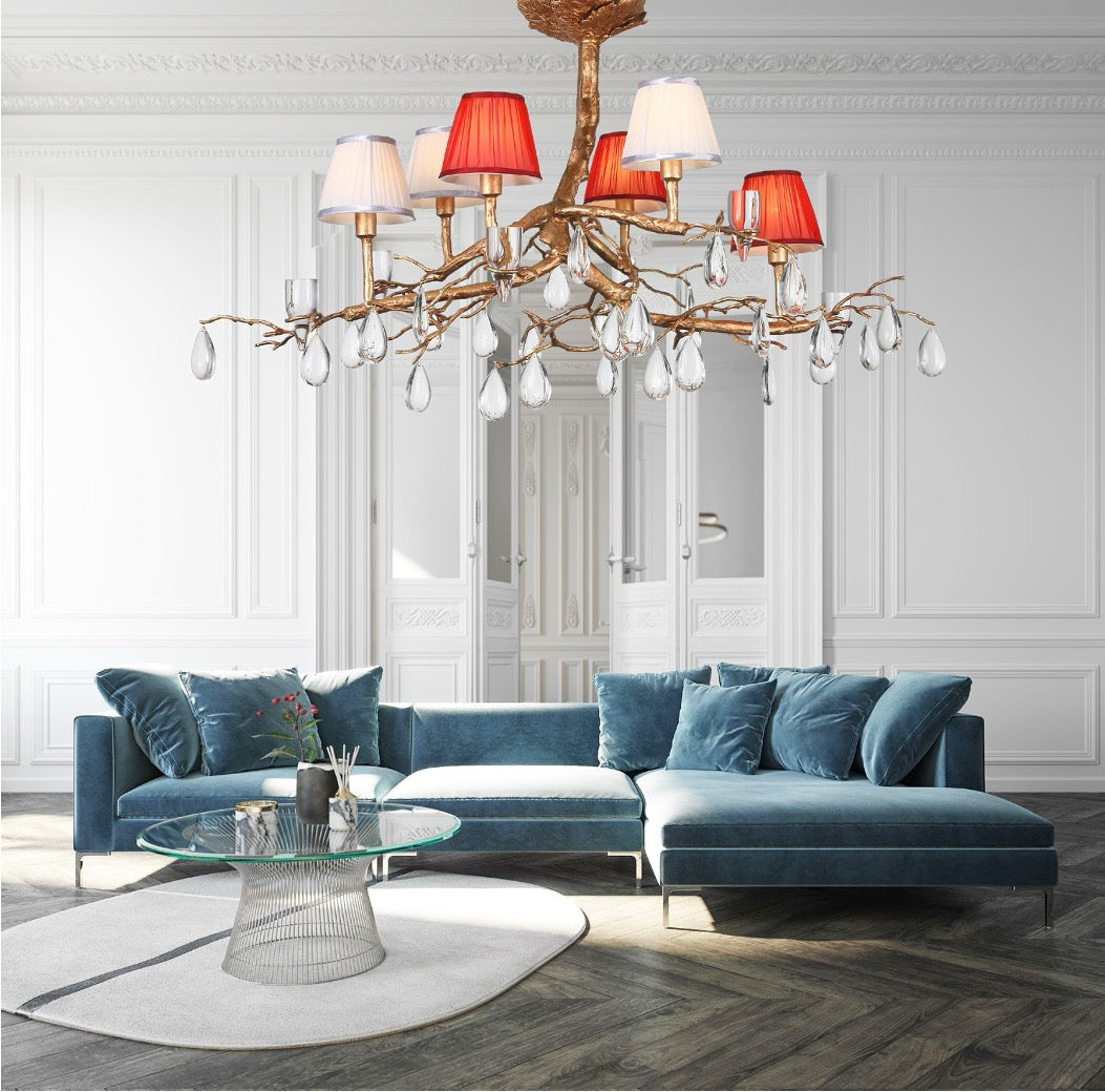 Chandelier with branching arms, mixed fabric shades, and crystal droplets.