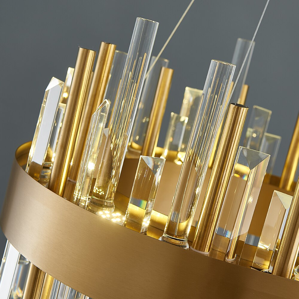 Close-up of intricate gold tubing and vertical crystal bars on the Ardmore chandelier.