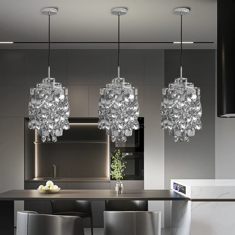 Arezzo pendants reflecting light with elegant symmetry above a kitchen island.