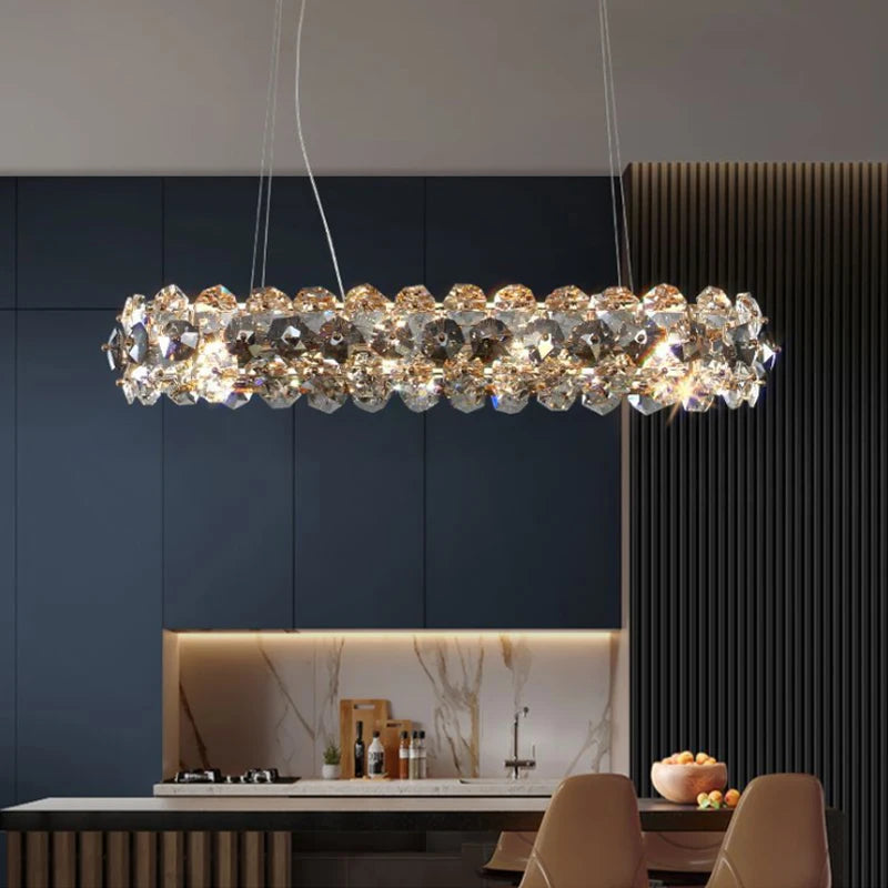 Astoria Rectangular Chandelier over a dining table, showcasing clear and smoky grey crystals.