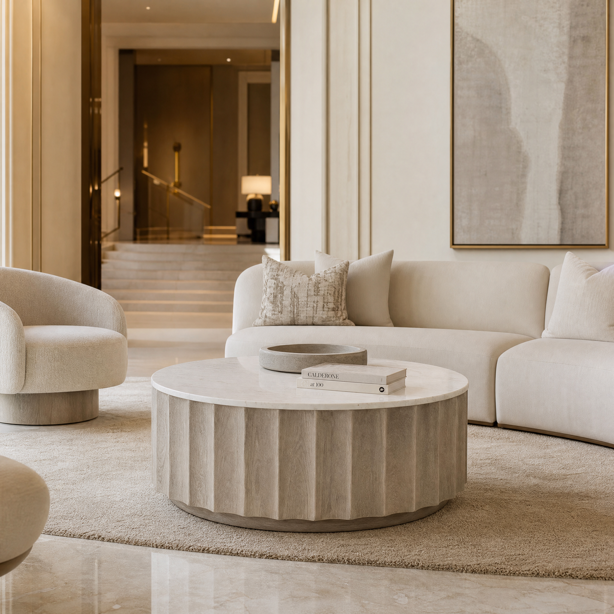 Astreva stonewash fluted coffee table by VORELLI styled in a modern residential living room setting.