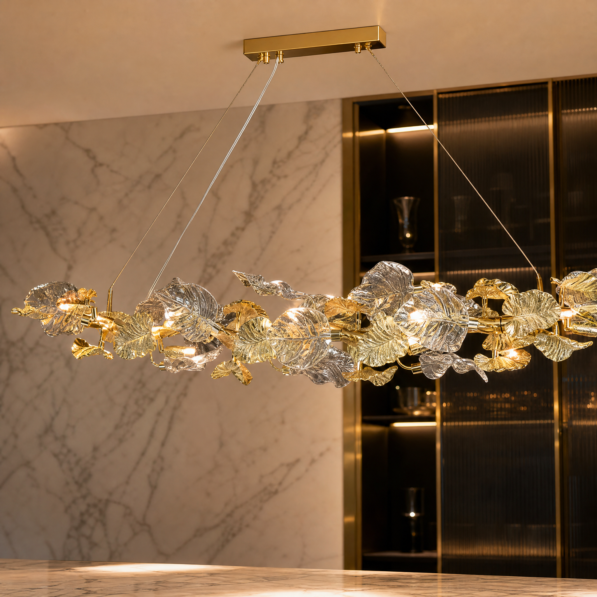 Detailed closeup of the layered sculptural glass leaves on the Aura Leaf Rectangular Chandelier