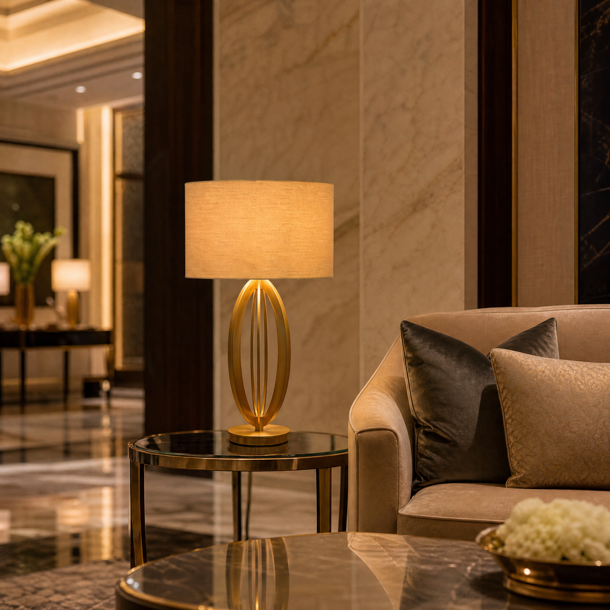 Sophisticated Aurevon gold open-frame table lamp placed in a contemporary boutique hotel bedroom