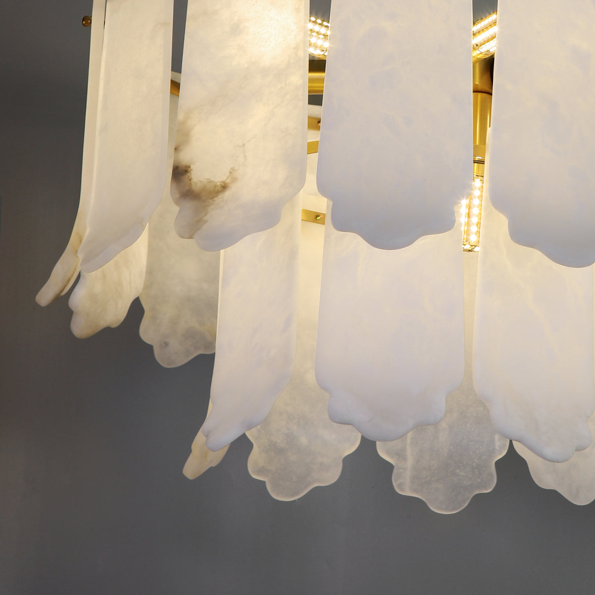 Close-up view of Avelina Chandelier highlighting the graceful marble panel detailing.