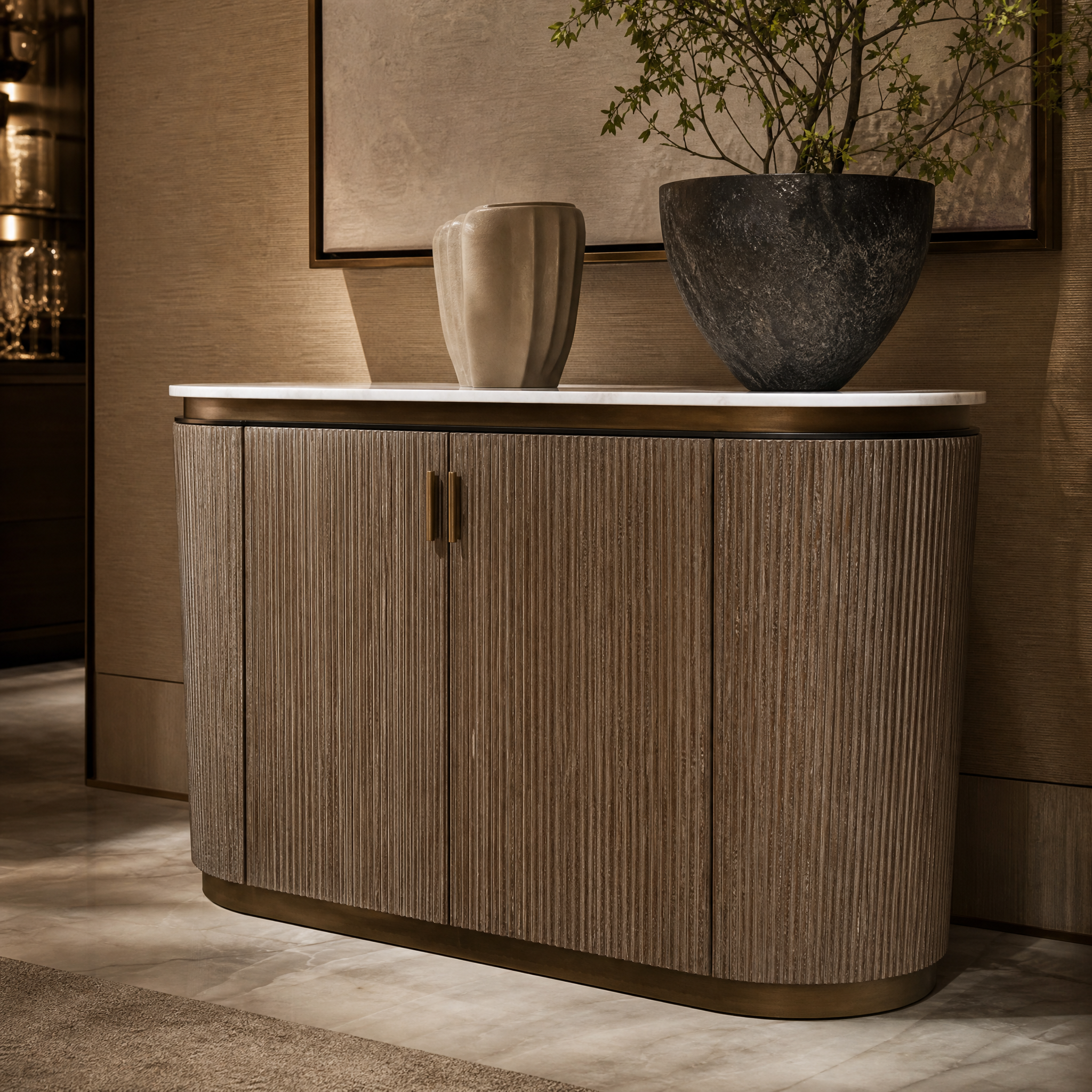 Close up detail of the Aventino oval console table showing the rich warm brass texture and neutral finish