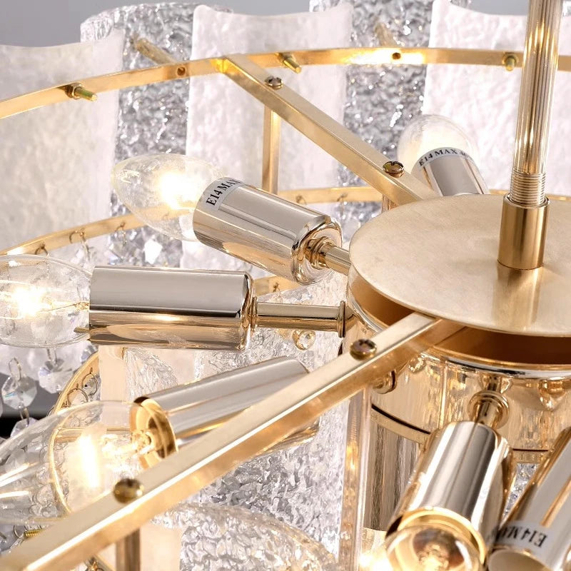 Side angle showcasing cascading crystal elements and textured panels of the Avino chandelier.