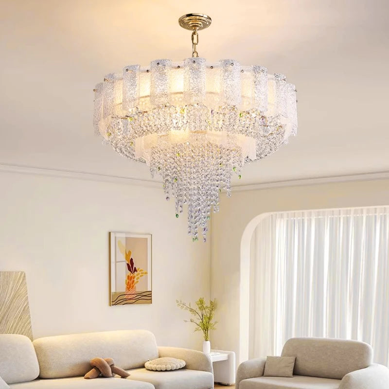 Side angle showcasing cascading crystal elements and textured panels of the Avino chandelier.