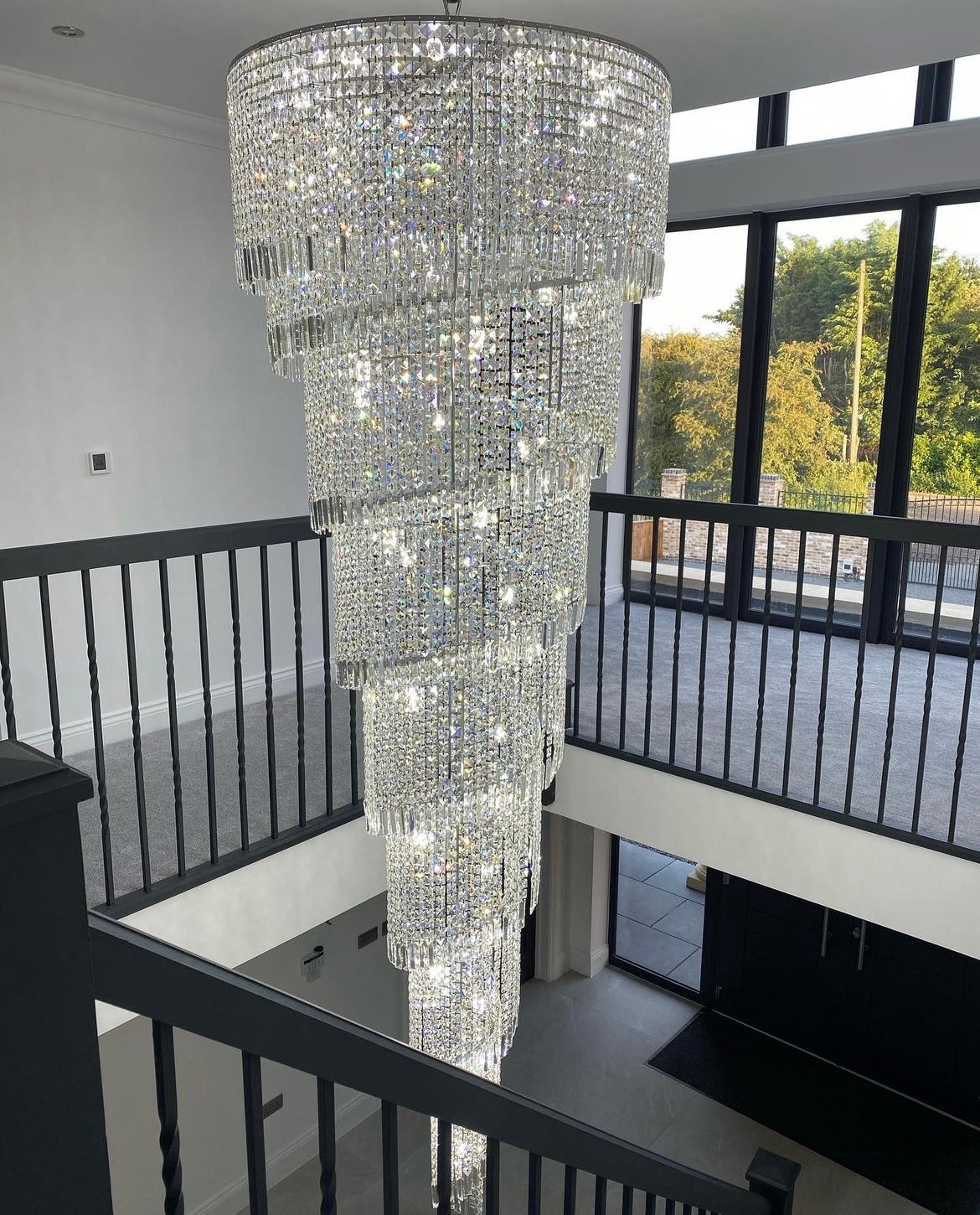 Close-up of Basilgio chandelier’s tiered crystal accents with sparkling clarity.