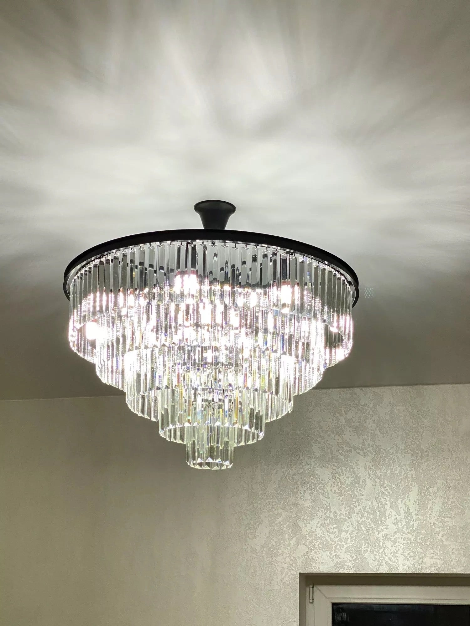 Beckenham circular chandelier used as a statement crystal ceiling feature