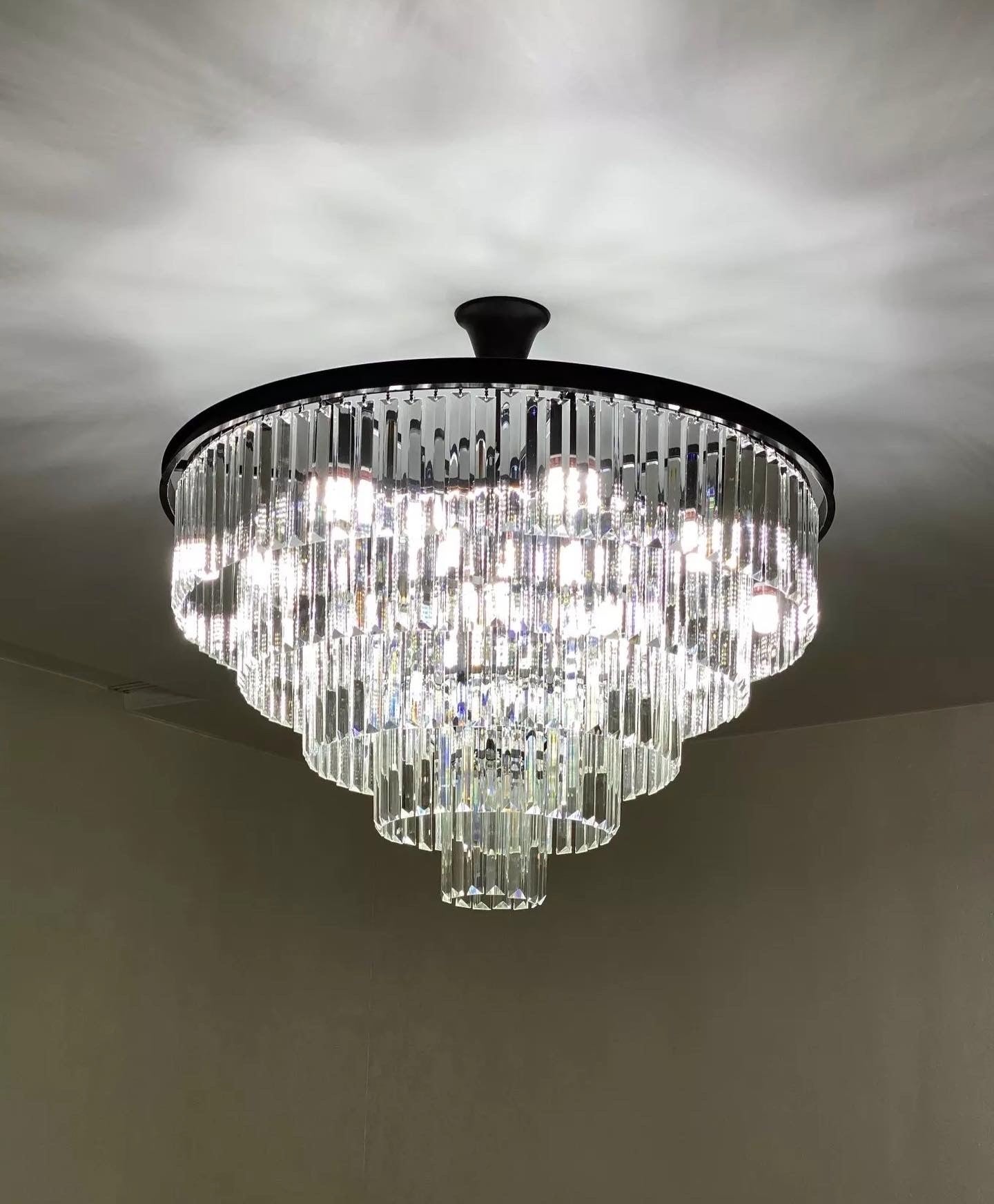 Beckenham circular chandelier featuring tiered diamond cut crystal in a luxury interior