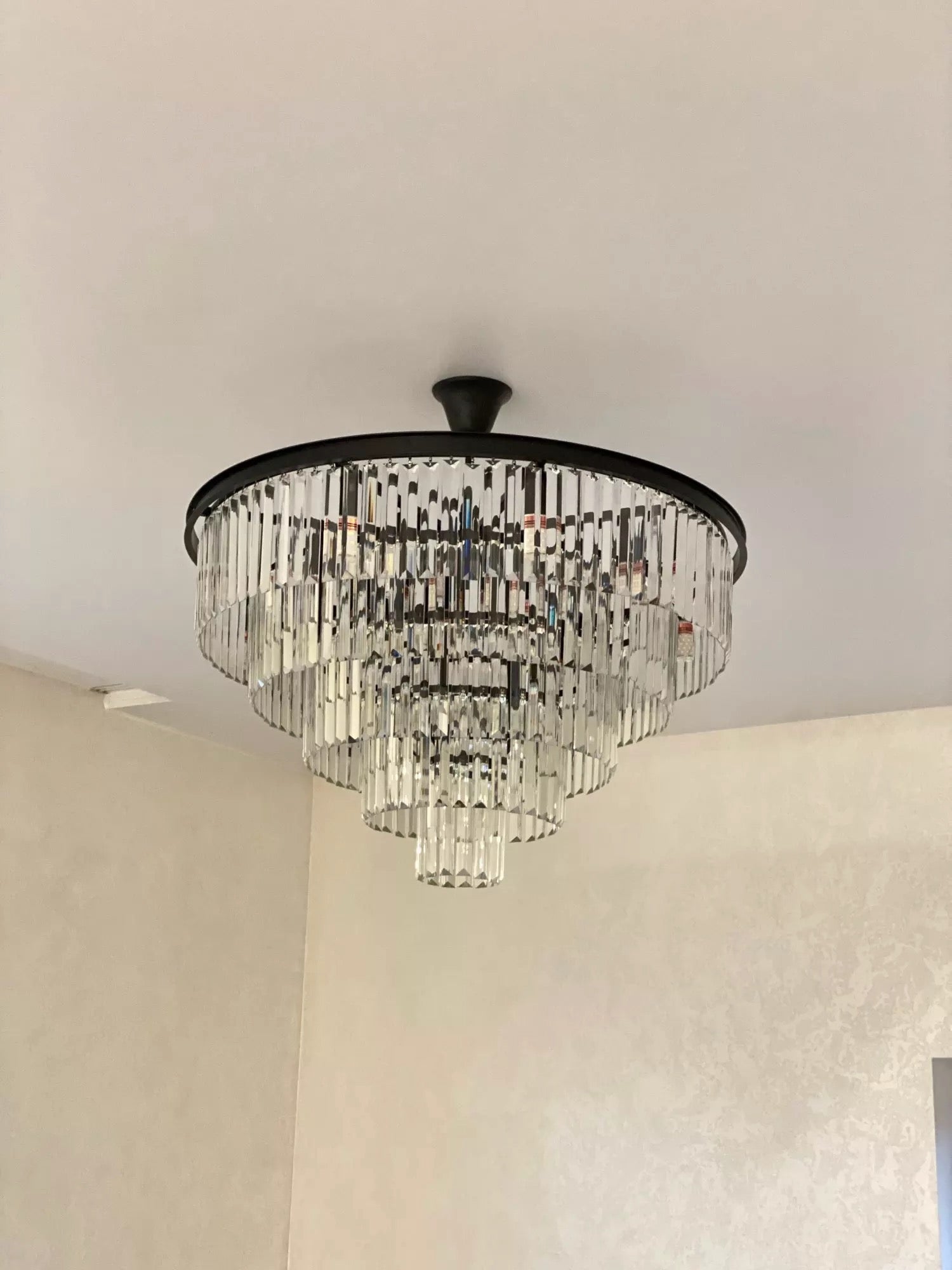 Beckenham circular chandelier installed in a modern luxury living space