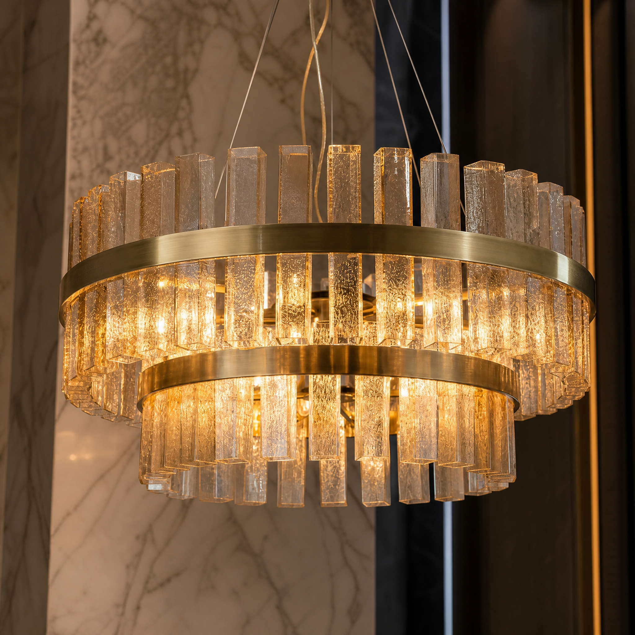 Close-up detail of the textured square glass rods on the VORELLI Bellarno chandelier, showcasing the layered depth and brilliant light refraction.