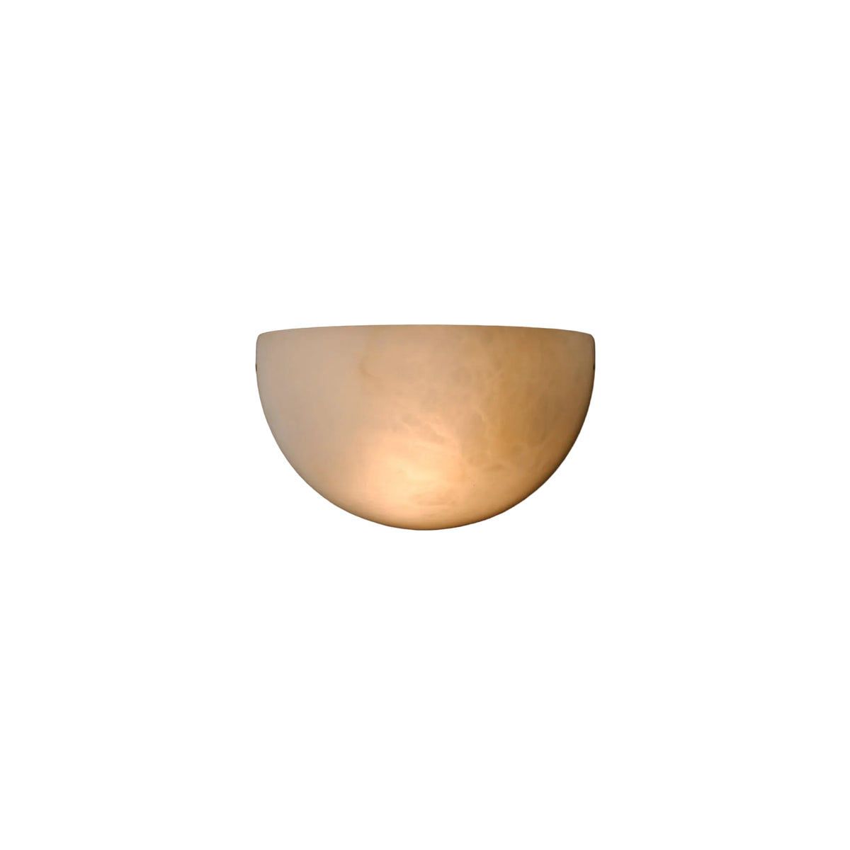 Half-sphere marble wall light emitting a warm, diffused glow on a textured wall.