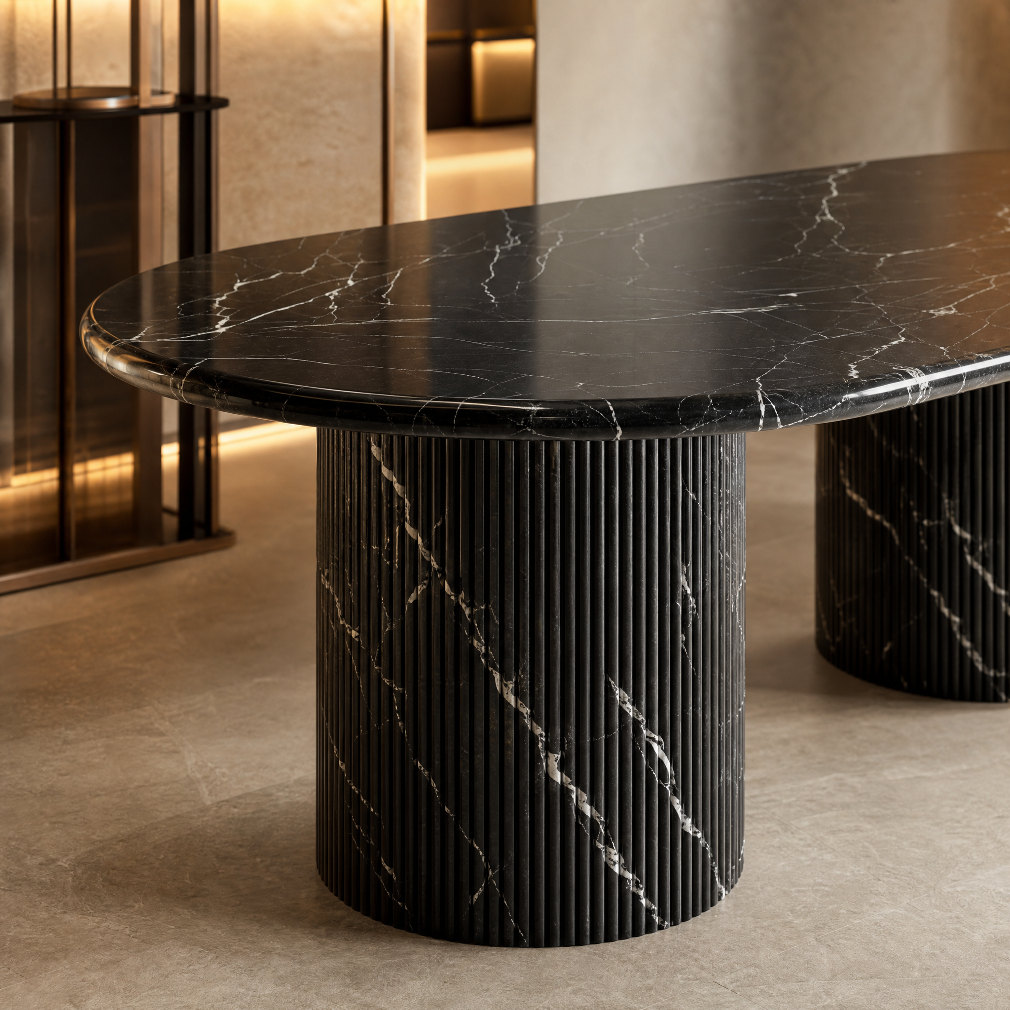 Detailed close-up of the VORELLI Black Marquina marble table top, highlighting the crisp white veining, polished finish, and the sculptural texture of the fluted stone base.