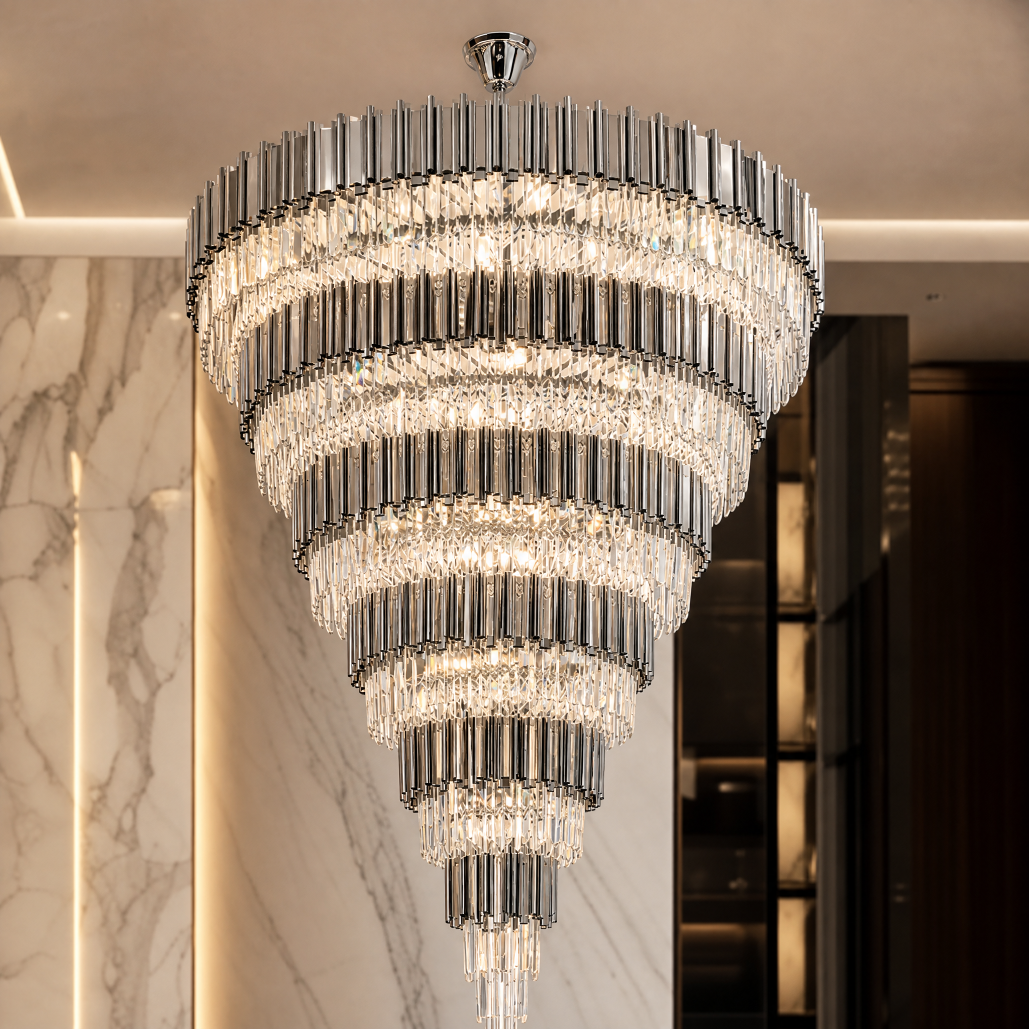 A macro close-up view of the VORELLI Boeotia Grandeur Chandelier, showcasing the intricate textures of the shimmering crystal bars and the clean lines of the bold cuboid tubing.