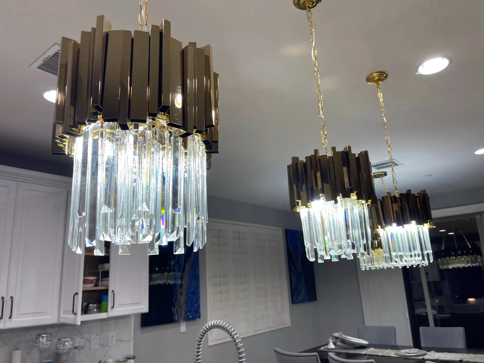 Boeotia pendant light with vertical diamond cut crystal bars in a luxury interior
