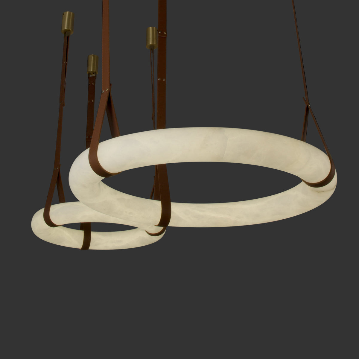 Botticino Marble Ceiling Light featuring dual illuminated marble rings suspended by leather straps.