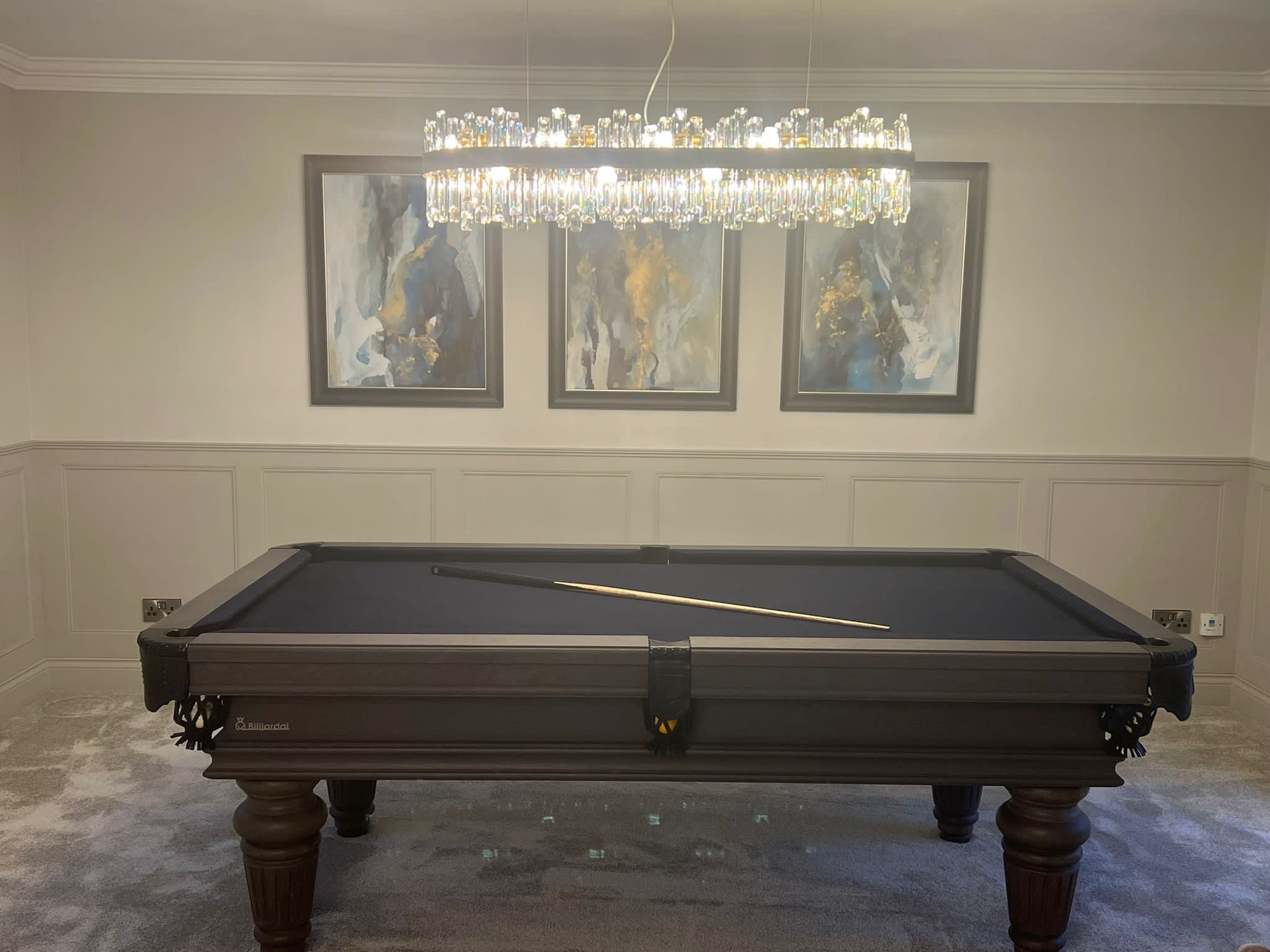 Brighouse rectangular chandelier installed above a luxury billiard table in a games room