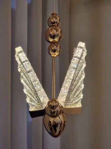 Butterfly pendant light styled within refined luxury interior setting