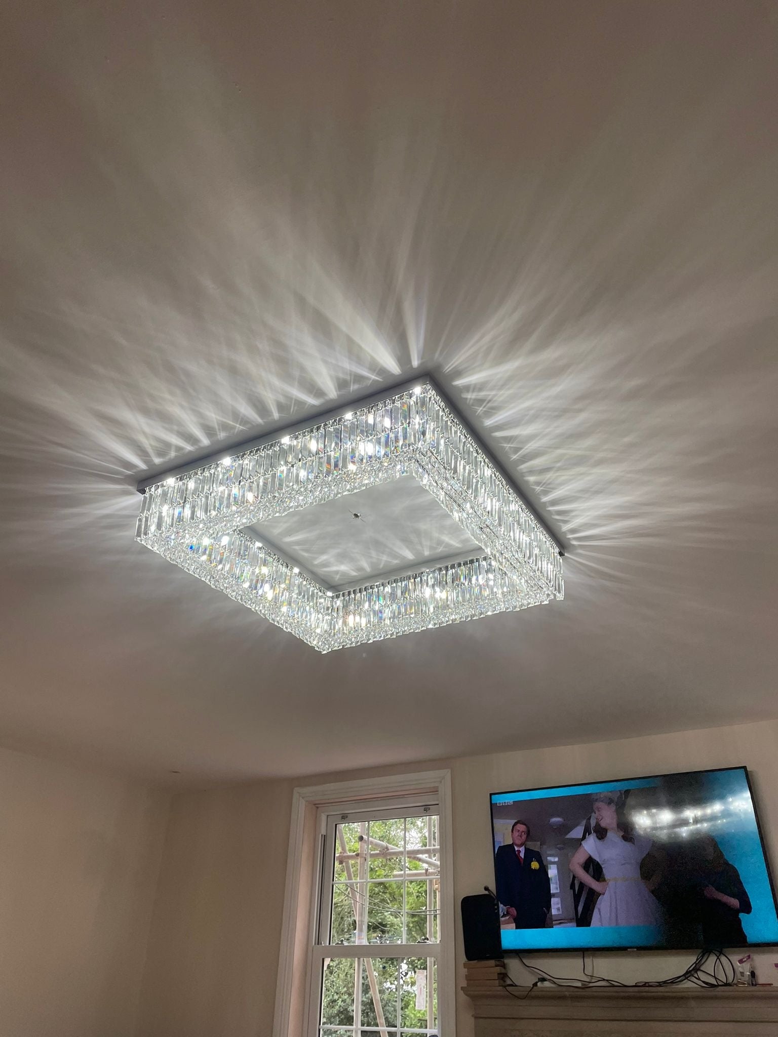 Chartrons square ceiling light illuminating a modern luxury interior with geometric crystal detail