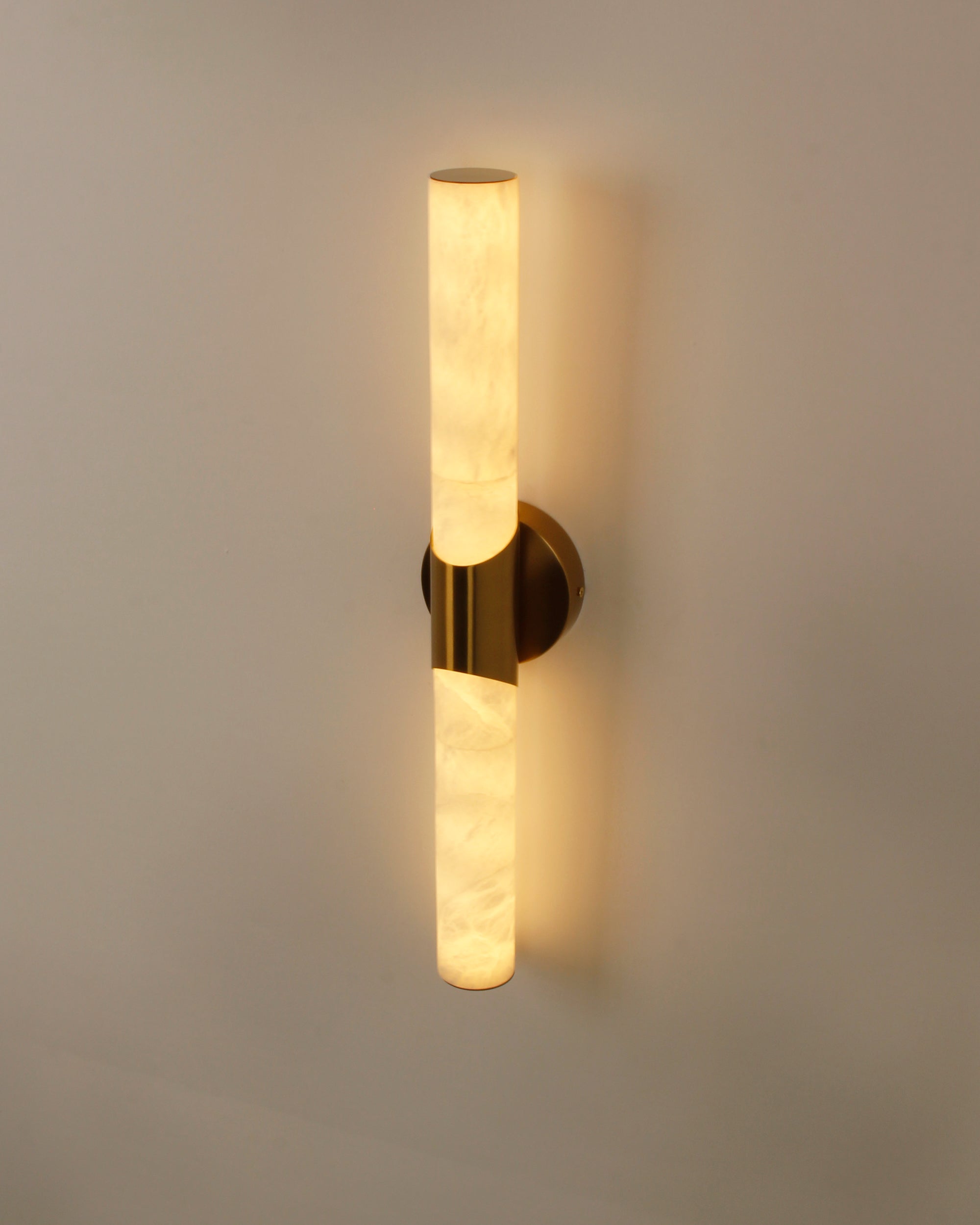 cilindro marble wall light side angle highlighting marble texture and brass detail
