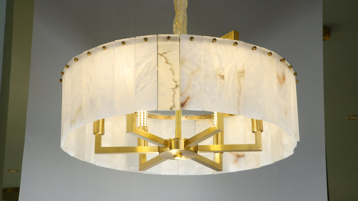 classisco marble chandelier illuminated to show warm ambient glow