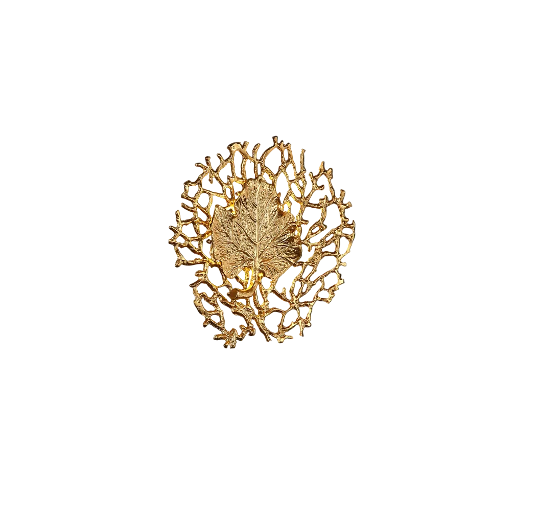 Close-up detail of the Aurelia wall light highlighting the intricate texture of the central sculptural leaf motif and its elegant metallic finish.