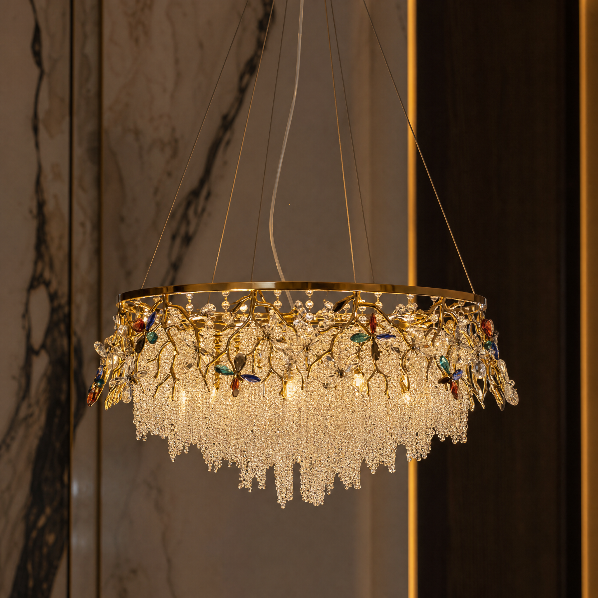 Macro photograph of the Wisteria Chandelier's golden branches and delicate crystal butterflies with diamond-cut glass beads.