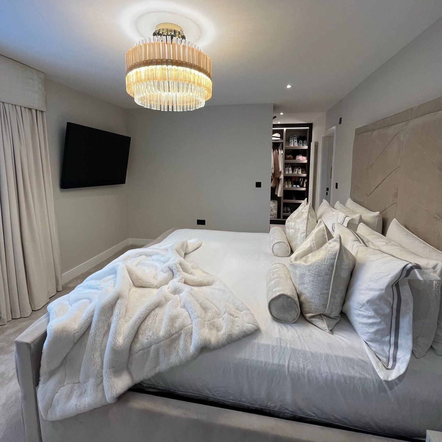 ceiling mounted condotti circular chandelier illuminating contemporary bedroom