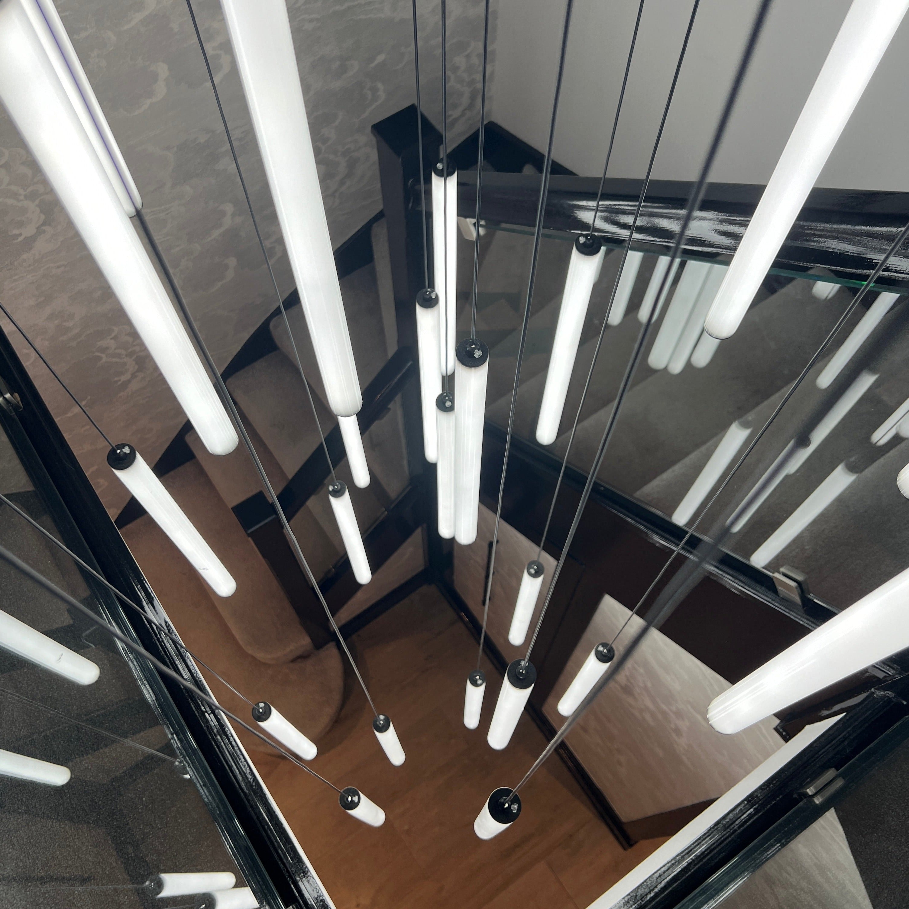 geometric arrangement of cowley pendants viewed from below highlighting symmetry