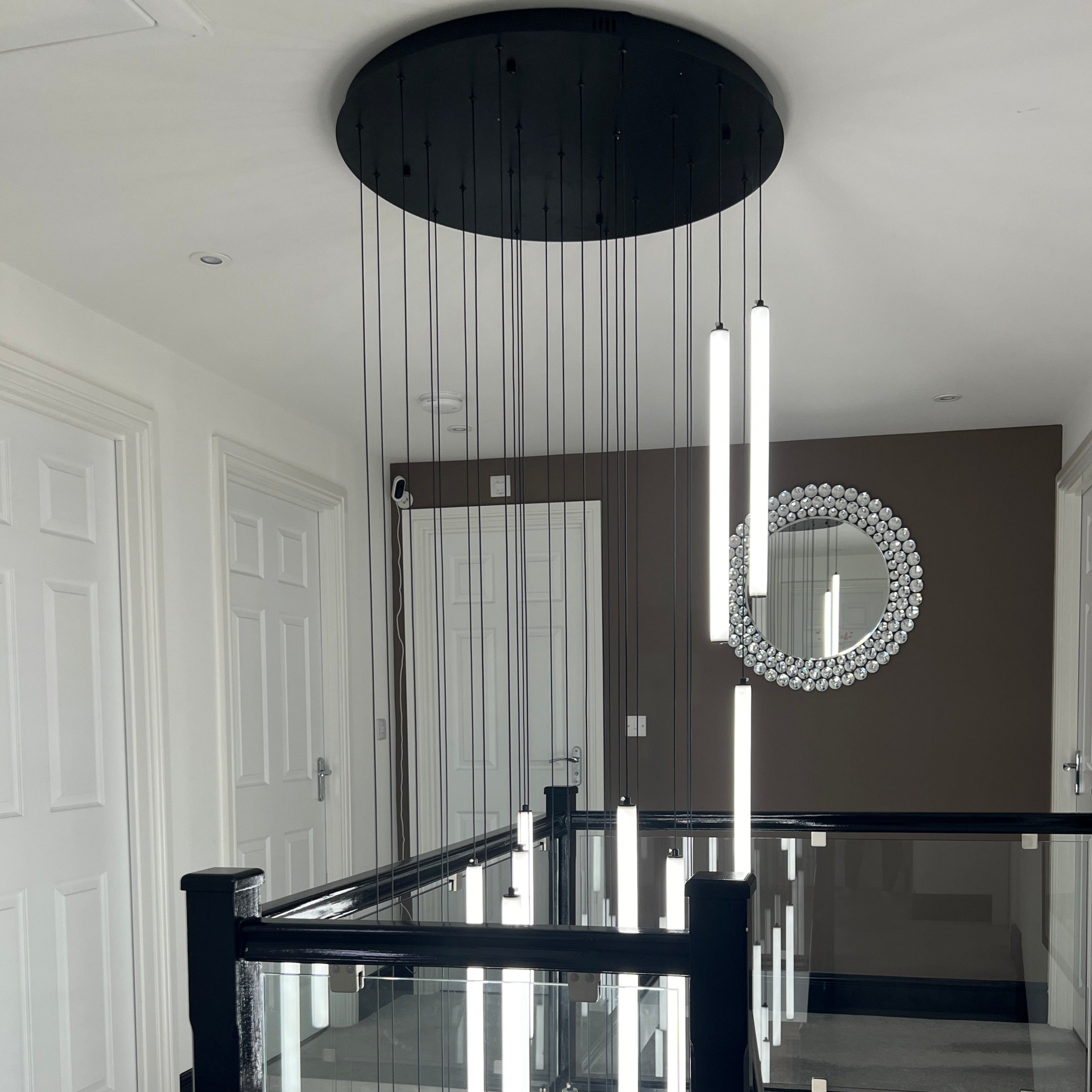 cowley pendant cluster displayed from ceiling showcasing vertical linear design