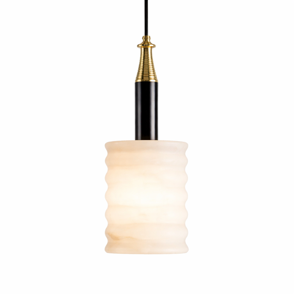 Detailed mood shot of the Noto marble pendant light, highlighting the rich texture of the fluted marble against its refined black and gold sculptural accents.