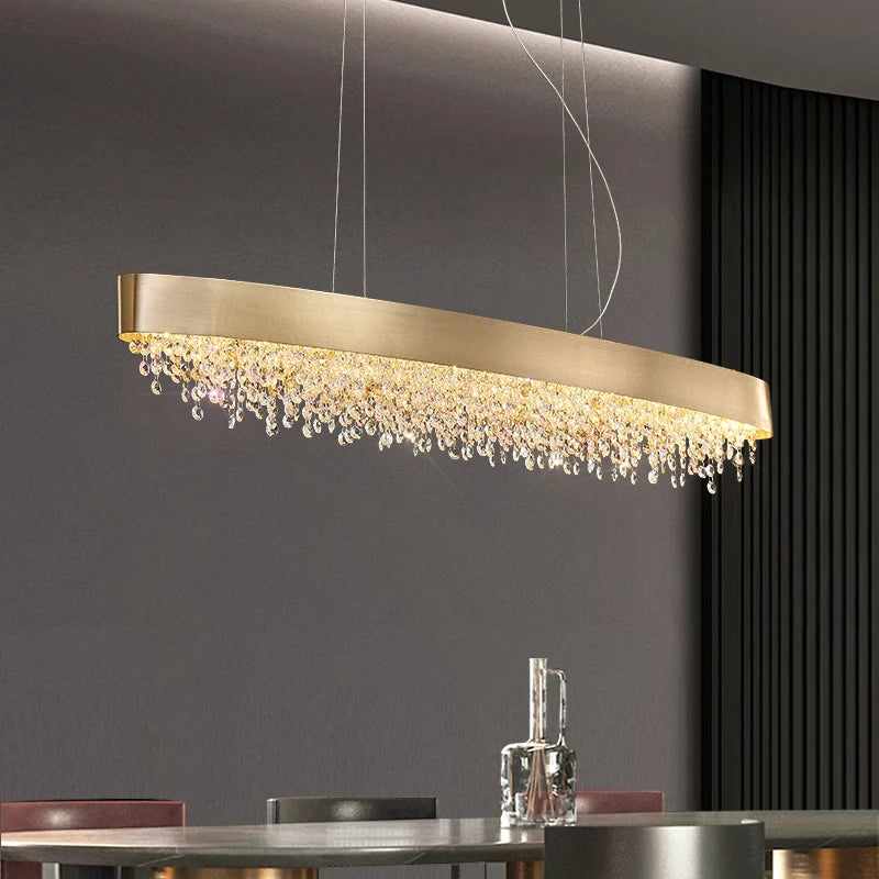 Donatello Rectangular Chandelier suspended above a dining setting with amber, clear, and pink octagon crystals