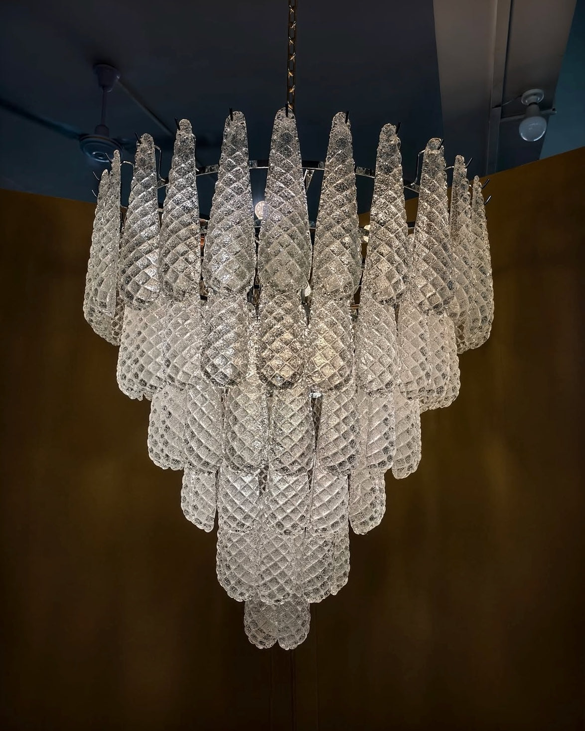 Eclissi Circular Chandelier in hand-crafted glass, illuminated luxury statement lighting by VORELLI®