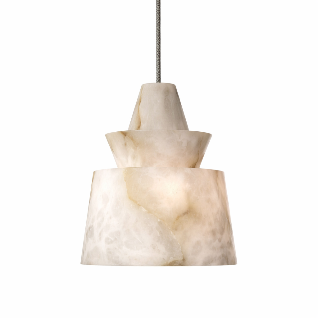Elegant Juno marble pendant light illuminated in a minimalist interior, highlighting its refined sculpted form and luxurious soft glow.