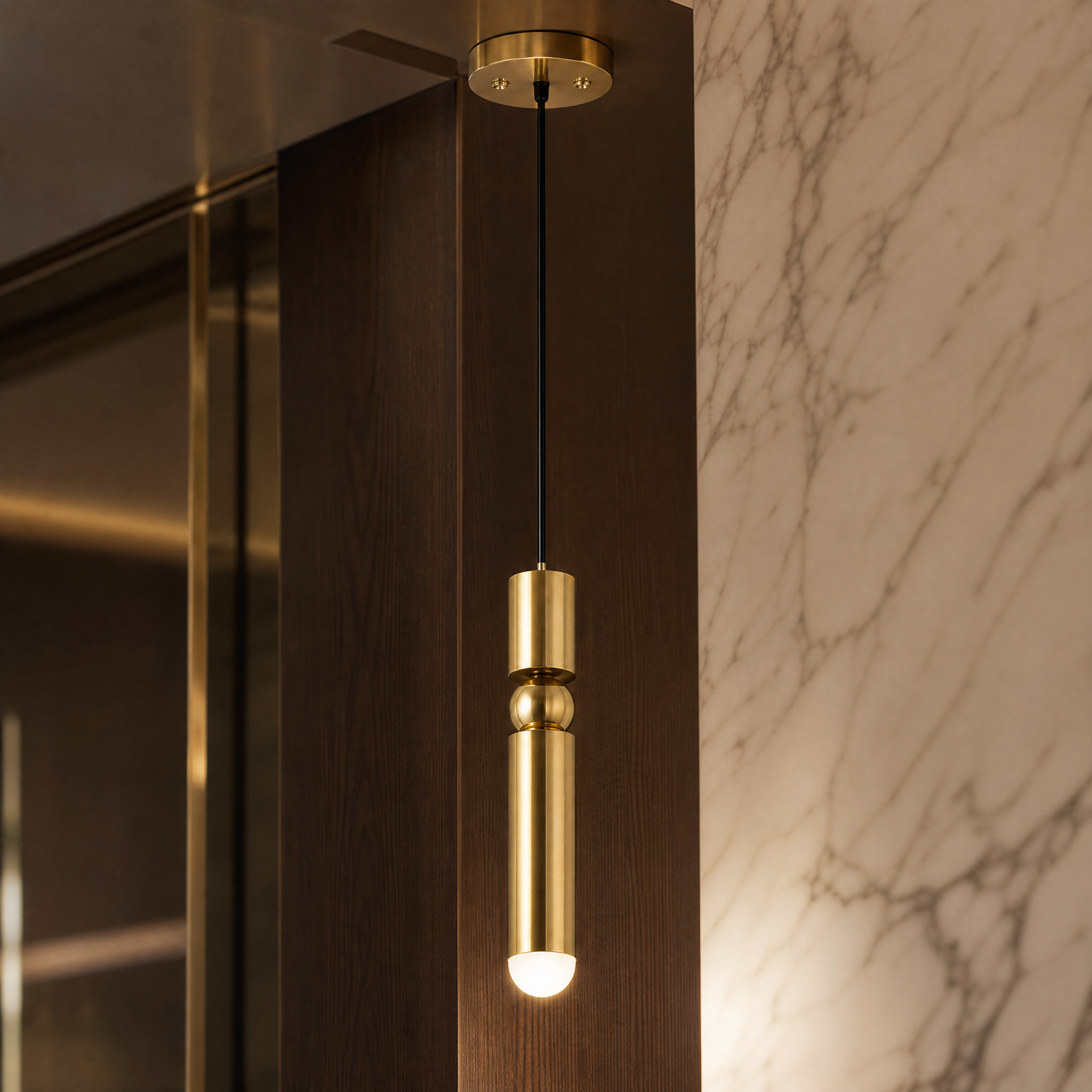 Macro closeup showing the high-quality brushed stainless steel frame finish and modern cylindrical craftsmanship of the VORELLI Gombe pendant light.